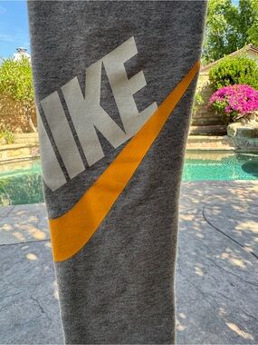 Nike Gray leggings with Orange Swoosh and White Logo